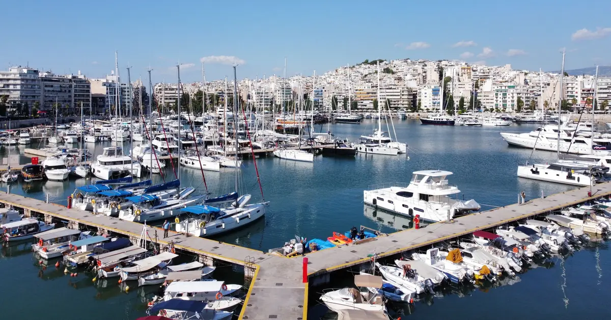 Rows of boats tied up in the slips of a marina